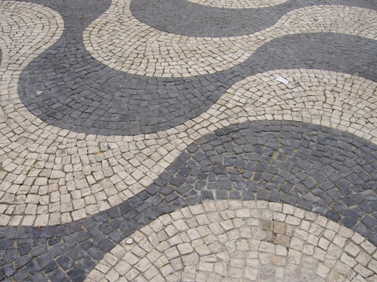 Cobblestone street in grey and tan serpentine pattern
